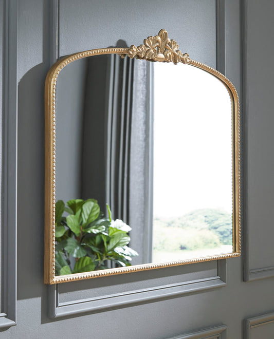 Enhance your space with the A8010320 gold accent mirror from Moda Home. A sleek, modern design perfect for adding elegance to any room.