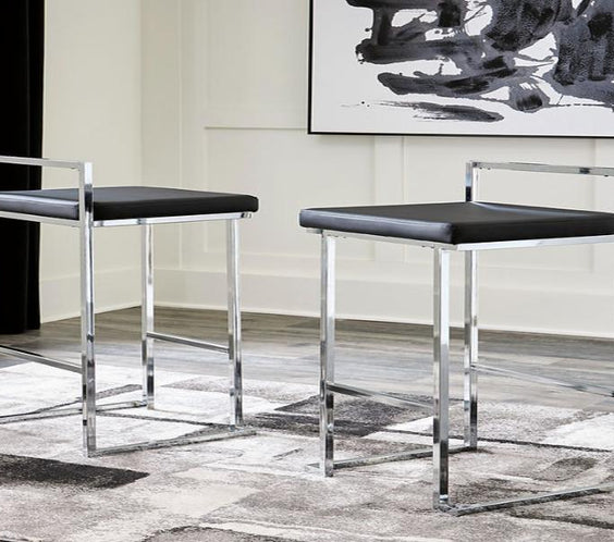 Madanere bar stool with sleek chrome finish and black faux leather seat. Stylish, compact, and perfect for modern kitchens or home bars.
