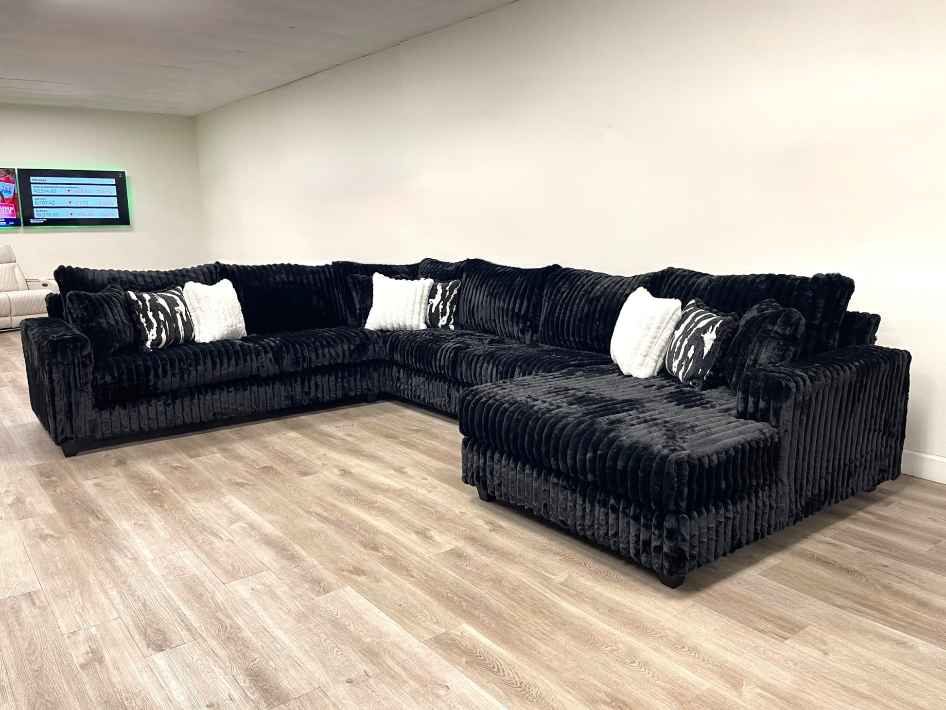 9900 4PC black oversized sectional sofa with 9 pillows from Moda Home Furniture, featuring plush cushions and elegant design for large living rooms.