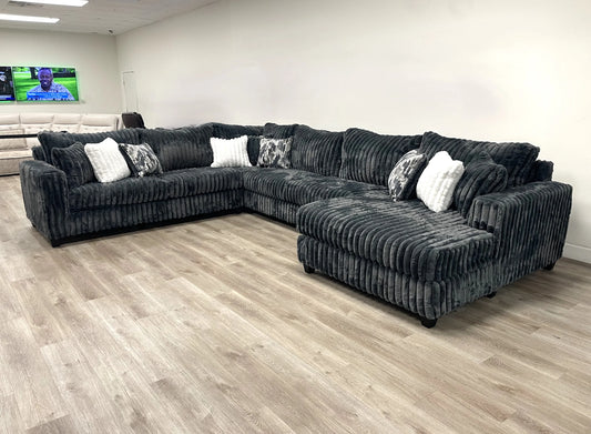 9900 Charcoal 4PC Oversized Sectional Sofa from Moda Home Furniture in plush fabric with 9 pillows, ideal for large living spaces.