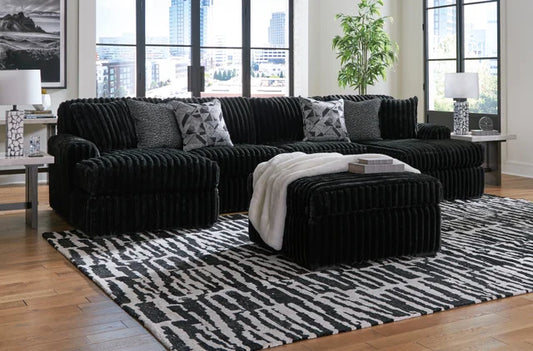 Ashley 981-03 3-piece black double chaise sectional with ottoman and accent pillows, designed for comfort and modern style from Moda Home Furniture