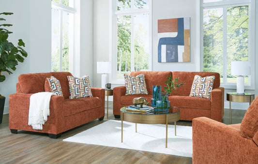 Ashley spice-colored sofa and loveseat set with comfortable seating and elegant design by Moda Home Furniture