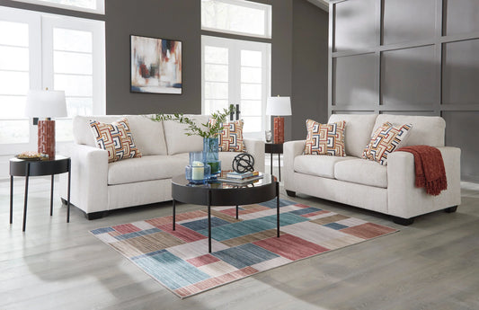 Ashley stone-colored sofa and chaise sectional with plush cushions and modern design by Moda Home Furniture