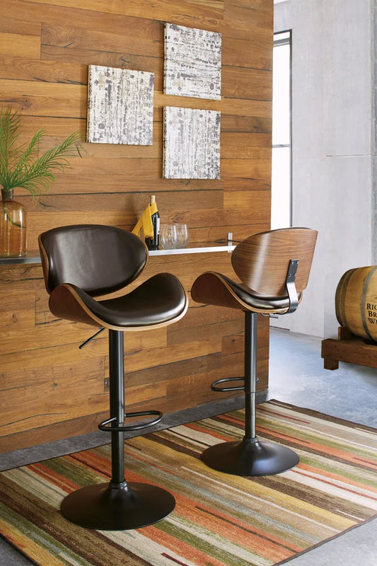 Brown faux leather tall barstool with swivel, adjustable height, and matte black metal base – Moda Home Furniture

