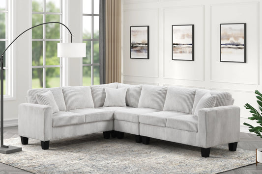 Logan beige reversible sectional upholstered in soft polyester cord fabric by Moda Home Furniture, perfect for cozy and spacious living rooms