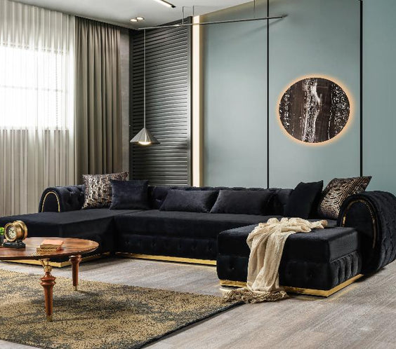 Elevate your space with the Jessie Black Velvet Sectional. Featuring gold accents, plush velvet, and double chaise seating for ultimate luxury and comfort.