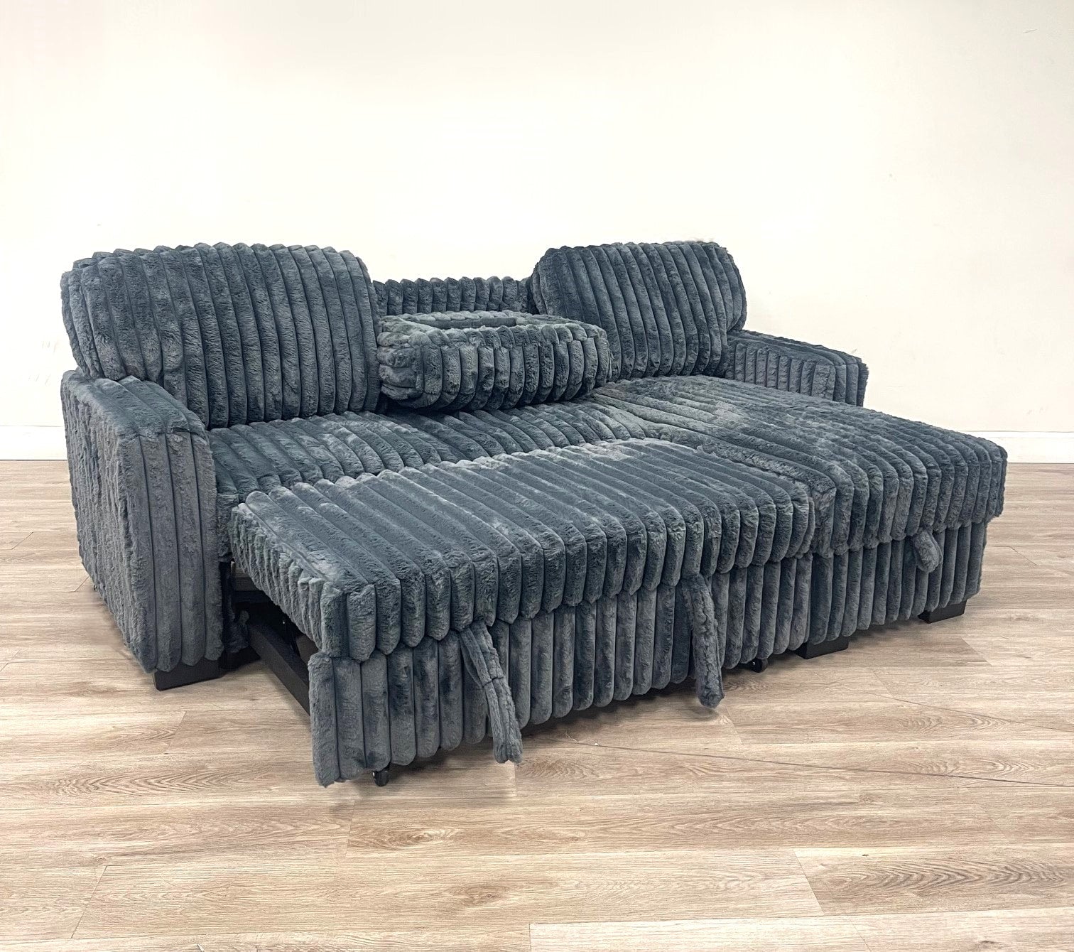 Poland charcoal reversible sectional sofa with pull-out bed and USB ports by Moda Home Furniture