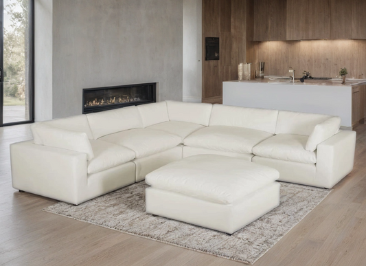 XL CLOUD SAND sectional with ottoman from Moda Home Furniture, featuring durable, moisture-repellent fabric and plush feather-fiber cushions for ultimate comfort.