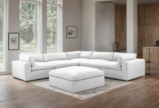XL CLOUD WHITE sectional with ottoman from Moda Home Furniture, featuring plush cushions and moisture-repellent fabric for a modern, stylish living room.