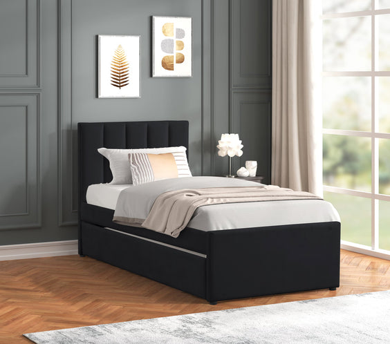 Sleek black velvet twin platform bed with pull-out trundle. Stylish, functional, and box spring-free. Perfect for guests or small spaces.