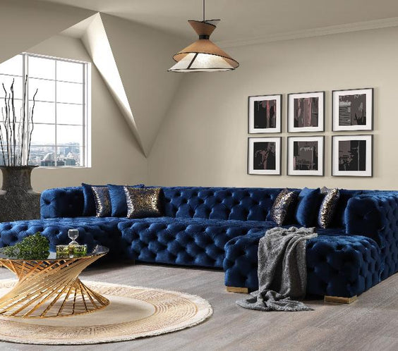 The Neva Blue Velvet Double Chaise Sectional offers plush velvet upholstery, deep seating, and a modern design—perfect for a luxurious and cozy living space.