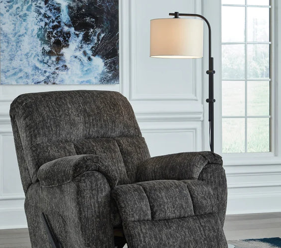 Relax in style with the Ashley 5260625 Rocker Recliner from Moda Home. Enjoy comfort and ease with a gentle rocking motion, perfect for any space.