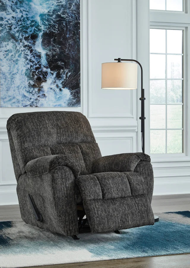 Relax in style with the Ashley 5260625 Rocker Recliner from Moda Home. Enjoy comfort and ease with a gentle rocking motion, perfect for any space.