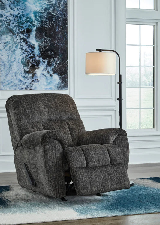 Relax in style with the Ashley 5260625 Rocker Recliner from Moda Home. Enjoy comfort and ease with a gentle rocking motion, perfect for any space.