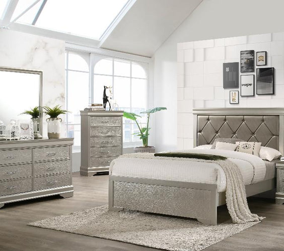 Upgrade your bedroom with the Amalia Silver Faux Leather Tufted Bedroom Set. Features a sleek wood frame and plush upholstery for a luxurious touch.