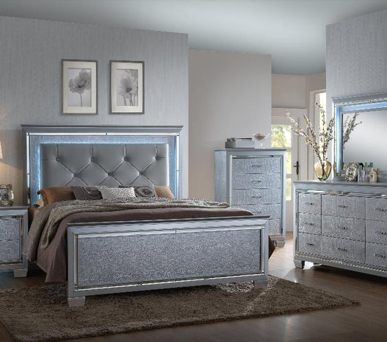 Add luxury to your bedroom with the Lillian Silver Sleek Contemporary LED Upholstered Tufted Bedroom Set. Elegant design meets modern comfort at Moda Home.