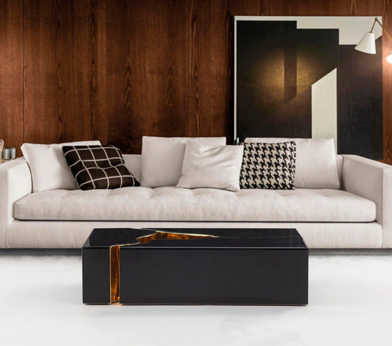 Enhance your space with the Dream Glass black and gold 3-piece coffee table from Moda Home. A sleek, modern centerpiece with a luxurious touch.